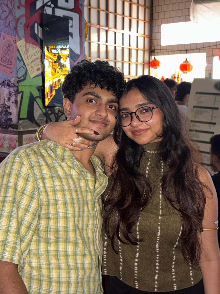 Two people posing together indoors